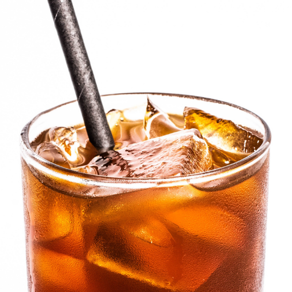 Glass of iced coffee, cold brew with a straw on a white background