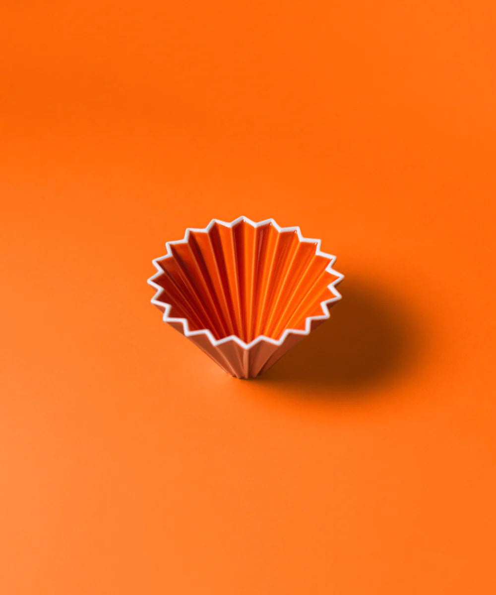 Orange Origami ceramic pour over coffee dripper made from Japanese Mino porcelain for cone and flat bottom filter brewing